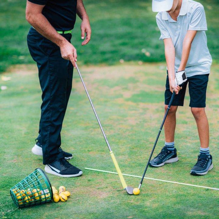golf tuition with junior student